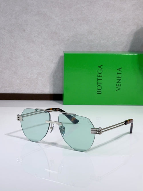 Bottega Veneta sunglasses with clear metal frame and green tinted lenses