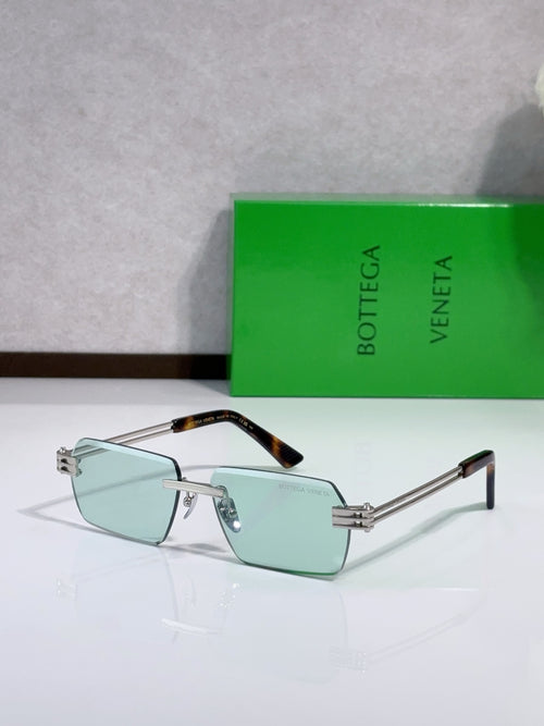Blue-tinted rectangle glasses with silver frame and tortoise temples