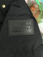 Black jacket shoulder patch with BURBERRY LONDON ENGLAND text