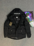 Black hooded puffer jacket with flap pockets and Burberry hood label