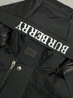 Black hooded puffer jacket hood lining with Burberry logo lettering