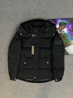 Black hooded puffer jacket with zip front and snap buttons