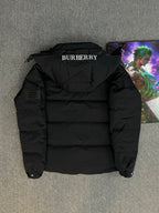 Black hooded puffer jacket back view with BURBERRY logo on collar