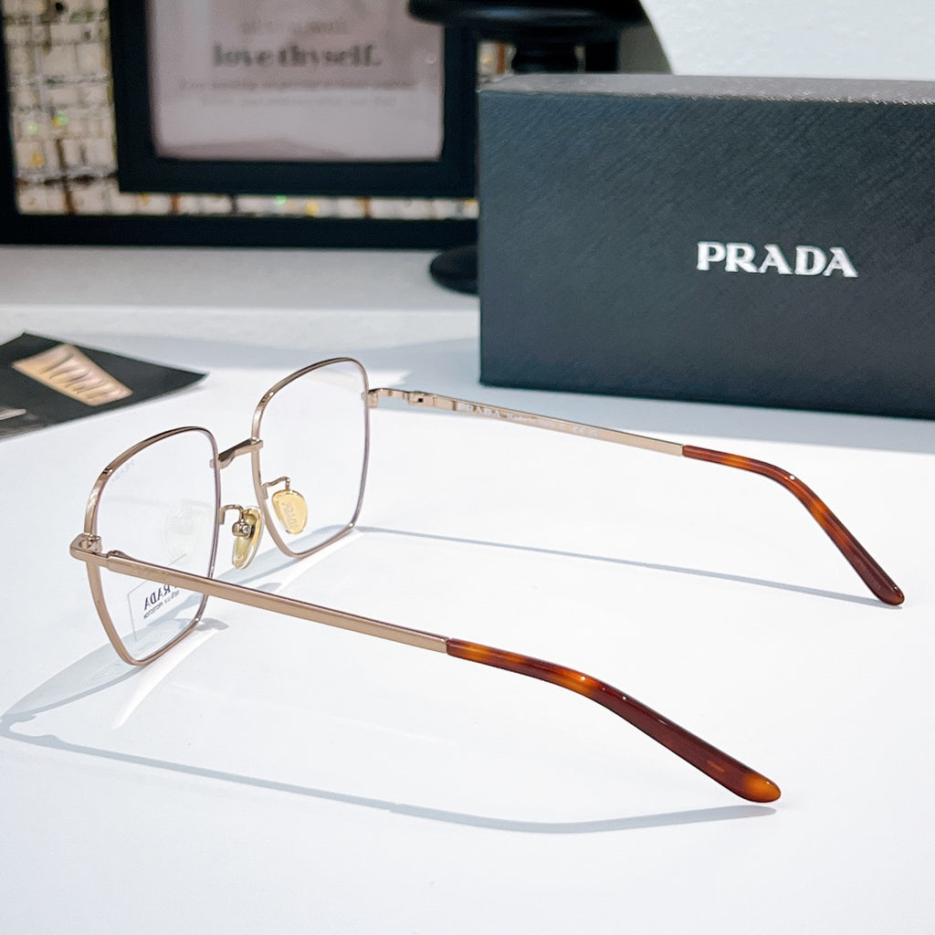 Prada glasses with gold square frames and clear lenses, brown tortoise temple arms.
