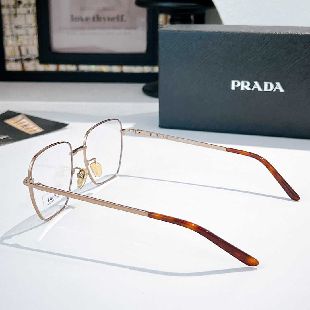 Prada glasses with gold square frames and clear lenses, brown tortoise temple arms.