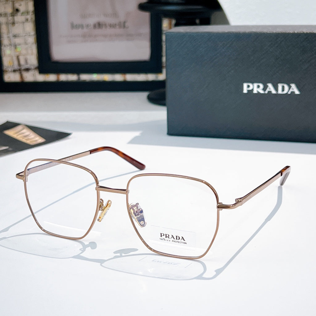 Prada glasses with rose-gold square frames and clear lenses, tortoise-toned temple.