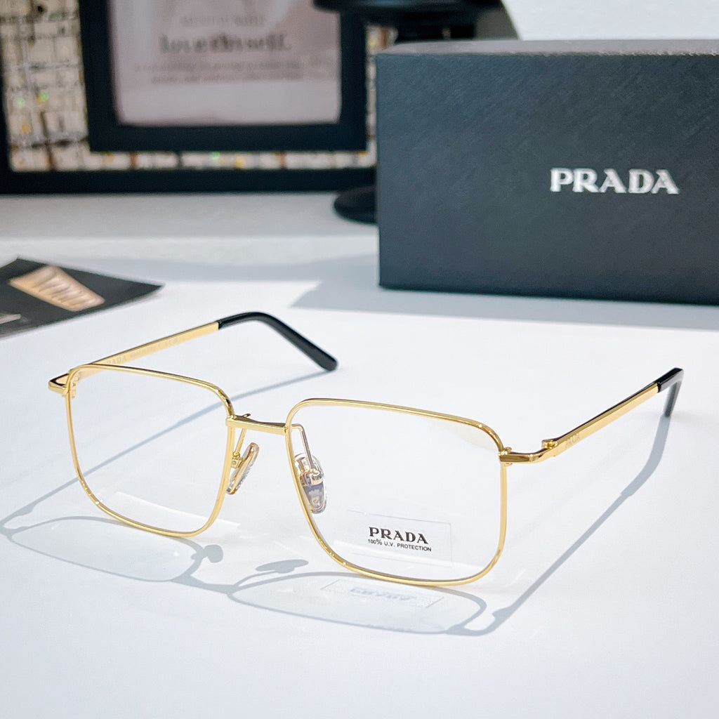 Prada eyeglasses with gold metal frame and clear lenses