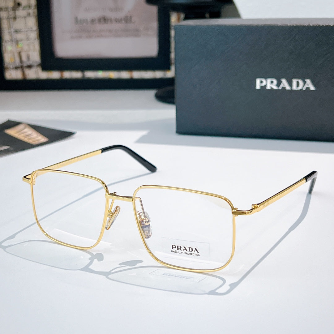 Prada eyeglasses with gold metal frame and clear lenses