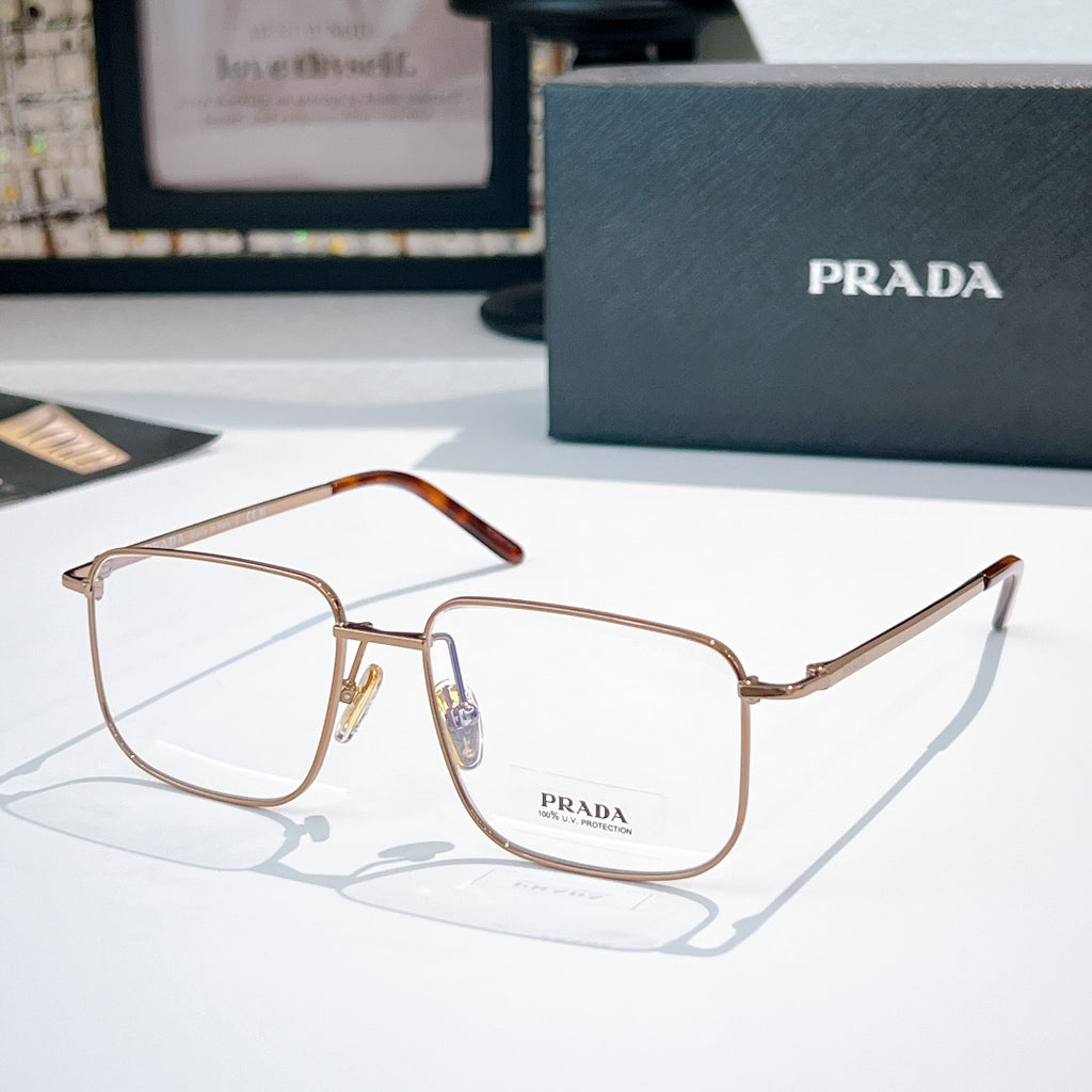 Prada eyeglasses with brown tortoise temples, gold metal frame, clear lenses