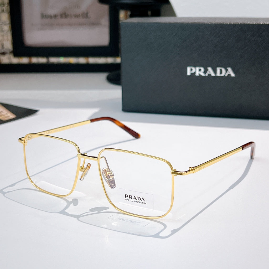 Prada eyeglasses with gold metal frame and clear lenses