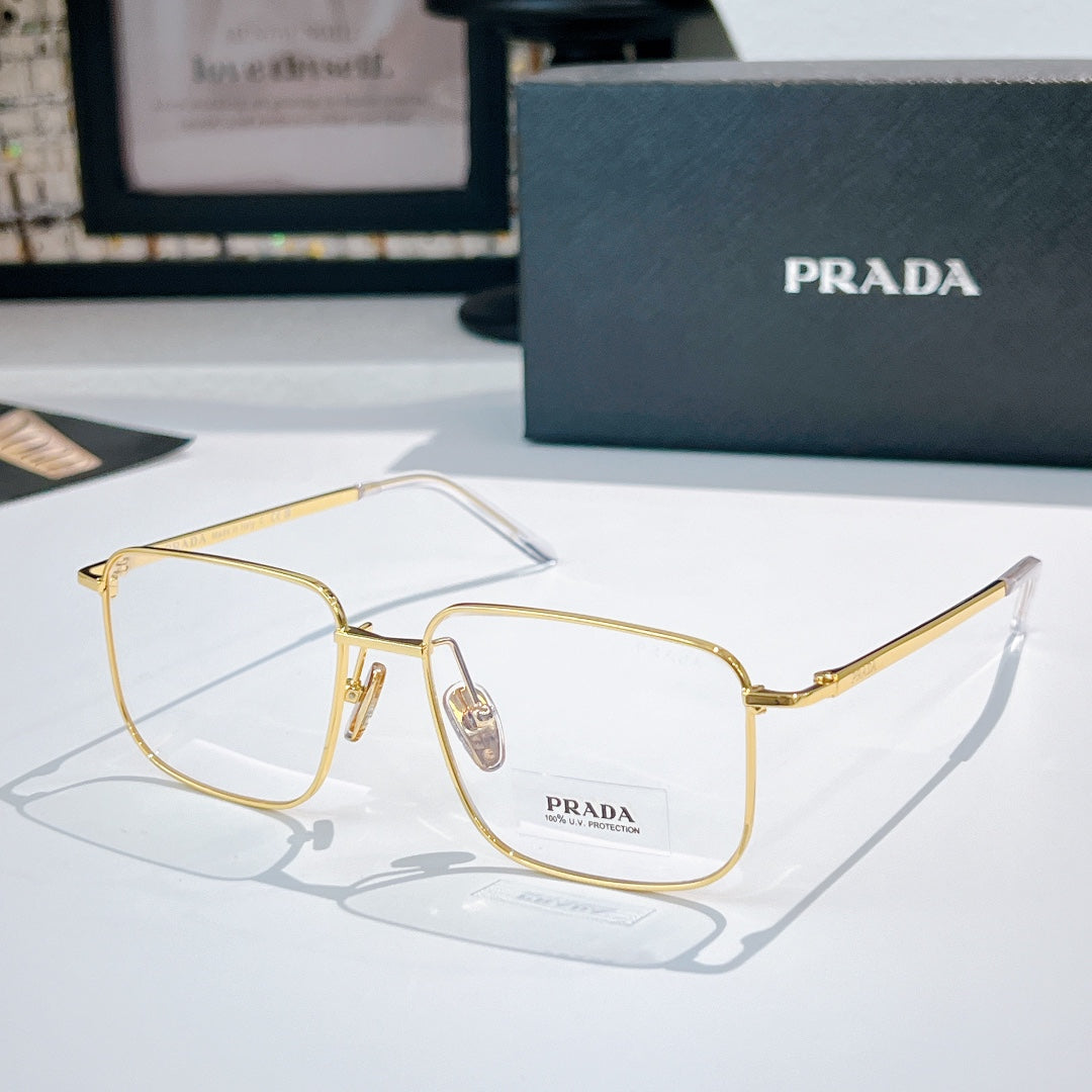 Prada eyeglasses with gold metal frame and clear lenses