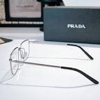 Prada eyeglasses with silver metal frame, black temples, and clear lenses