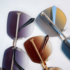 Bvlgari sunglasses set with purple, blue, and brown tinted lenses and metal frames