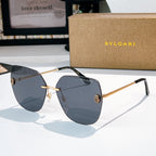 Bvlgari aviator sunglasses with dark blue lenses and gold metal arms