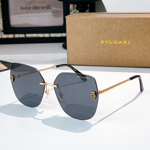 Bvlgari aviator sunglasses with dark blue lenses and gold metal arms