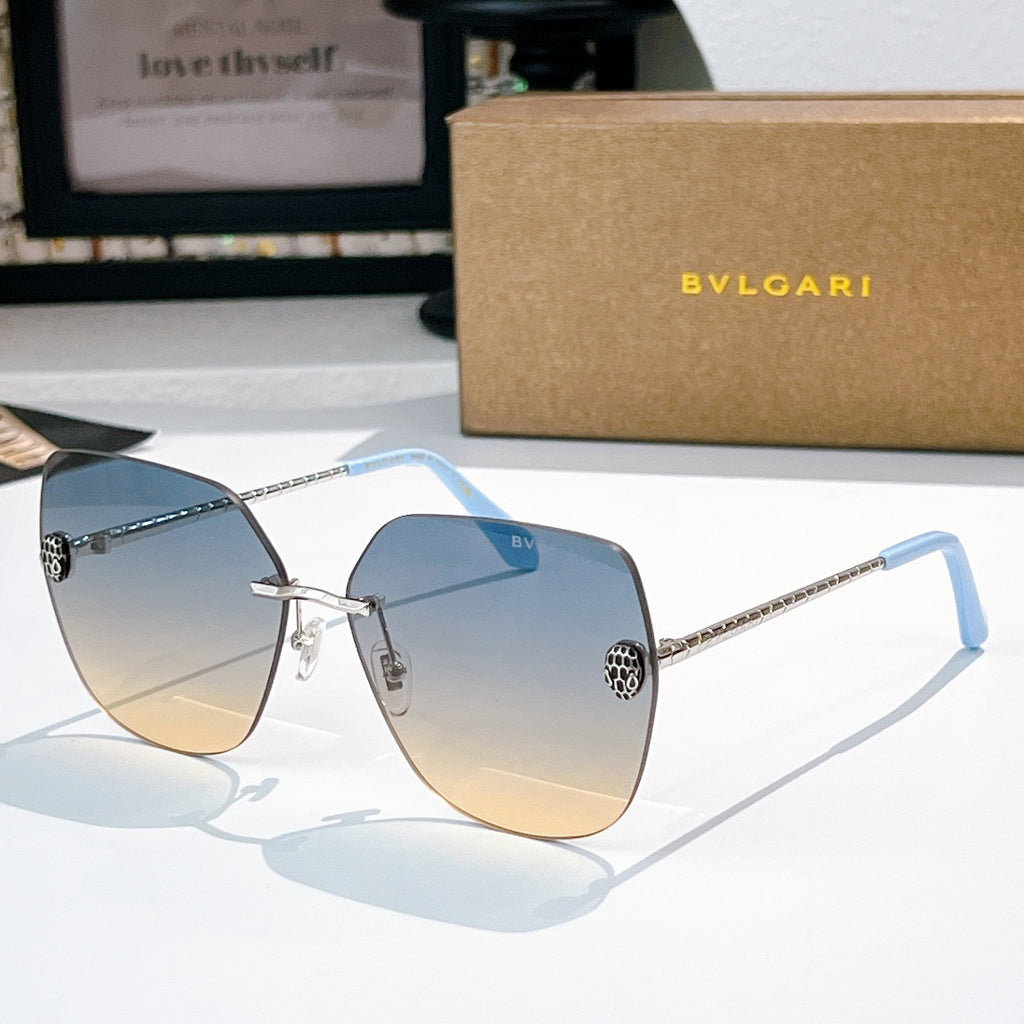Bvlgari aviator sunglasses with light blue gradient lenses and silver metal arms