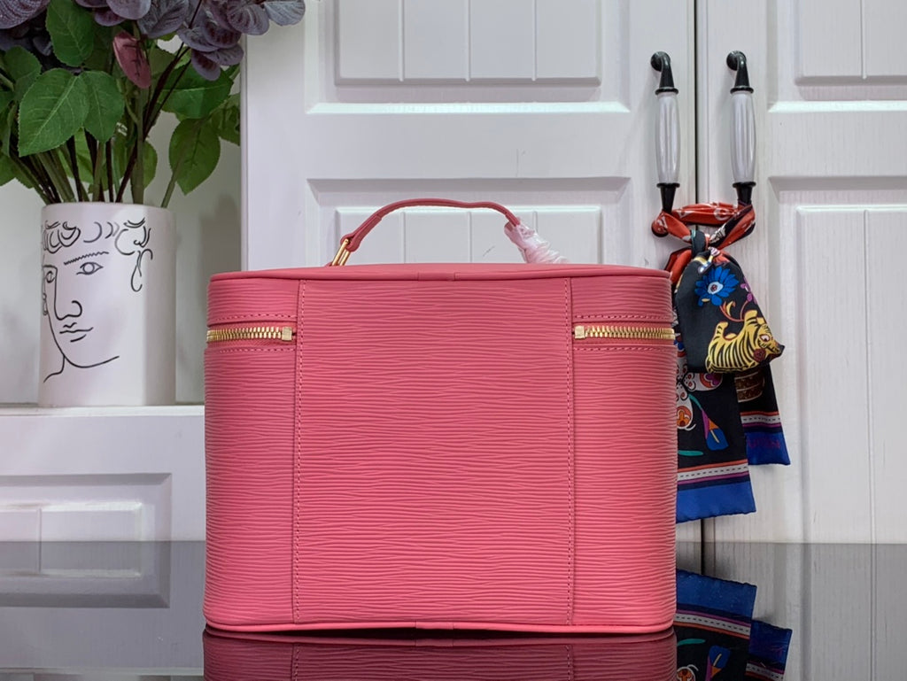 Louis Vuitton pink Epi leather handbag front with leather panels and top handles.