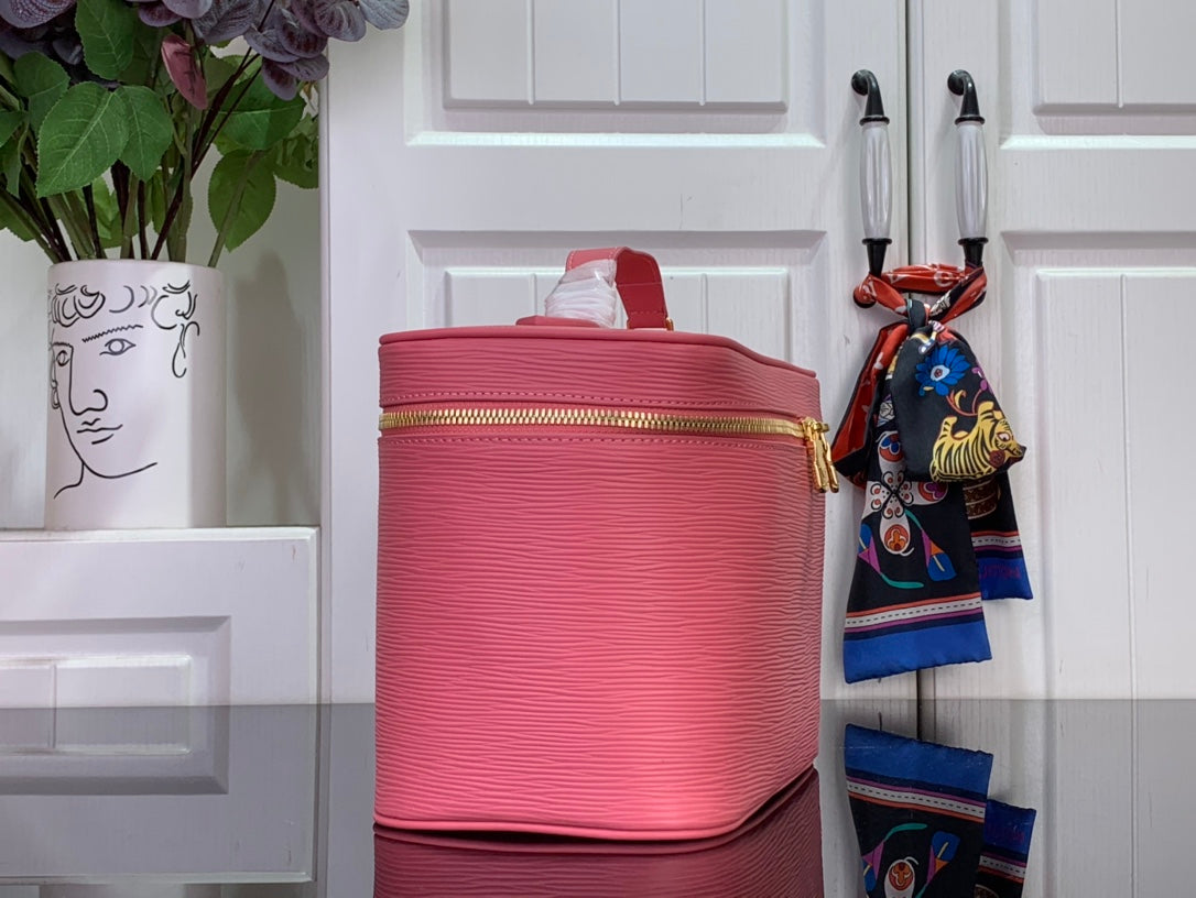 Louis Vuitton pink Epi leather handbag with top zipper and gold-tone lock detail.