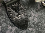 Louis Vuitton monogram handbag interior tag detail on textured dark leather.
