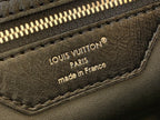 Louis Vuitton handbag leather label reading “Louis Vuitton Paris” and “made in France”.