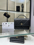 Black quilted flap Chanel bag with gold CC clasp and chain strap