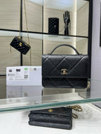 Black quilted flap Chanel bag with gold CC clasp and chain strap