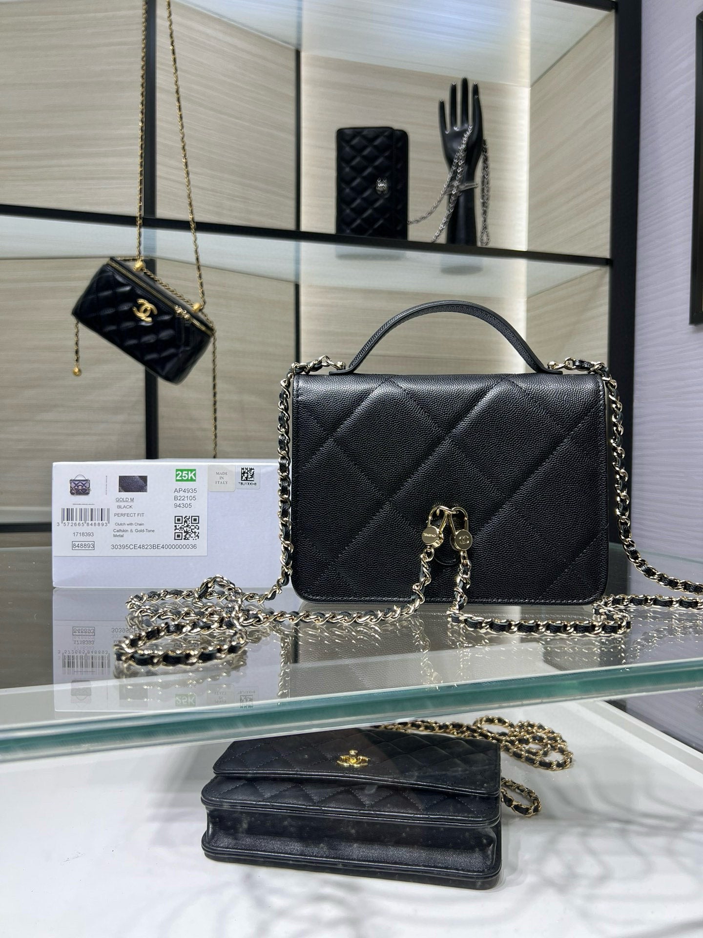 Black quilted Chanel satchel bag with gold CC turn-lock and chain strap