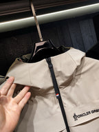 Beige hooded jacket with front zipper and logo print on chest