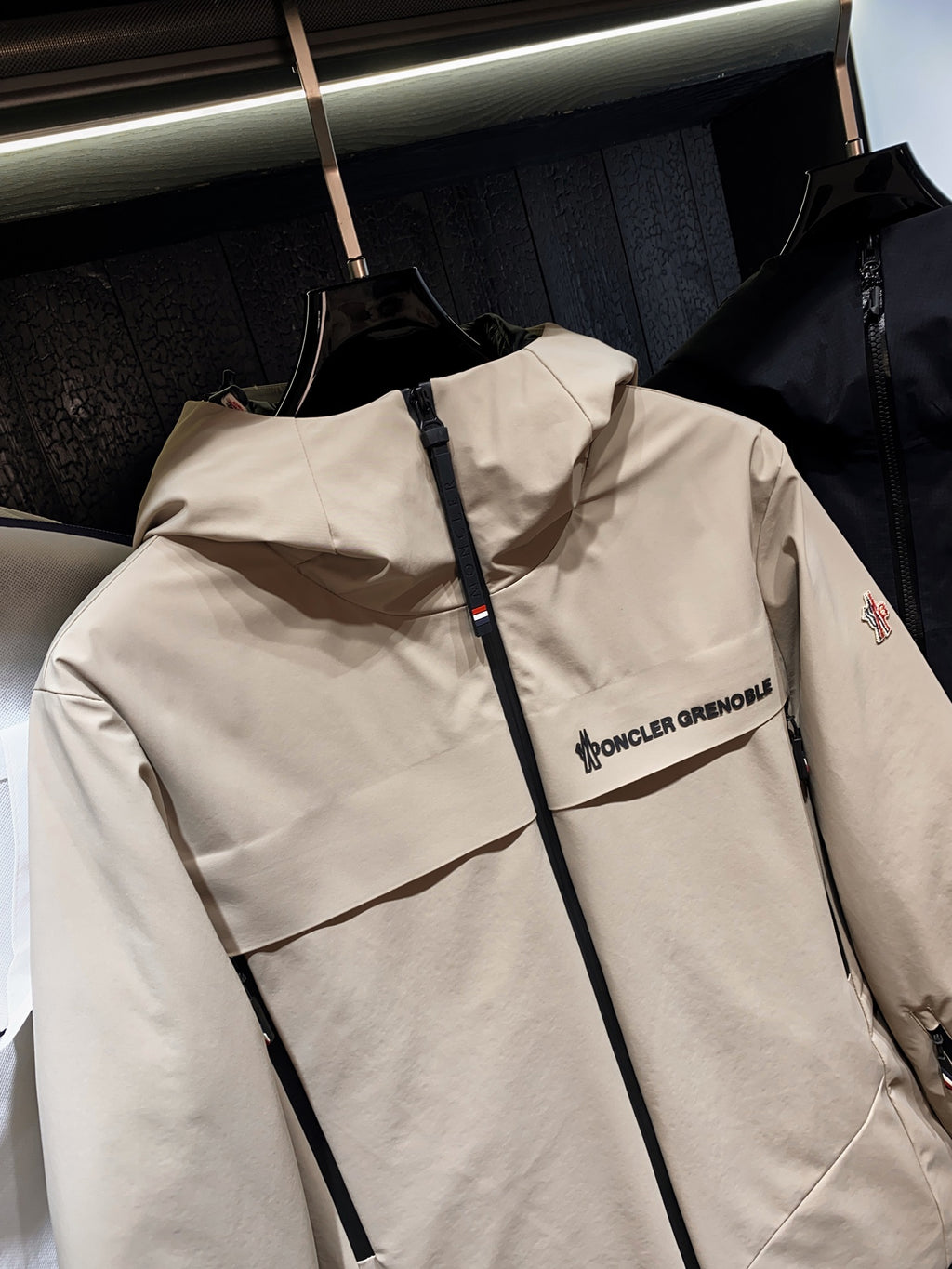 Beige hooded jacket with zip front and chest logo detail