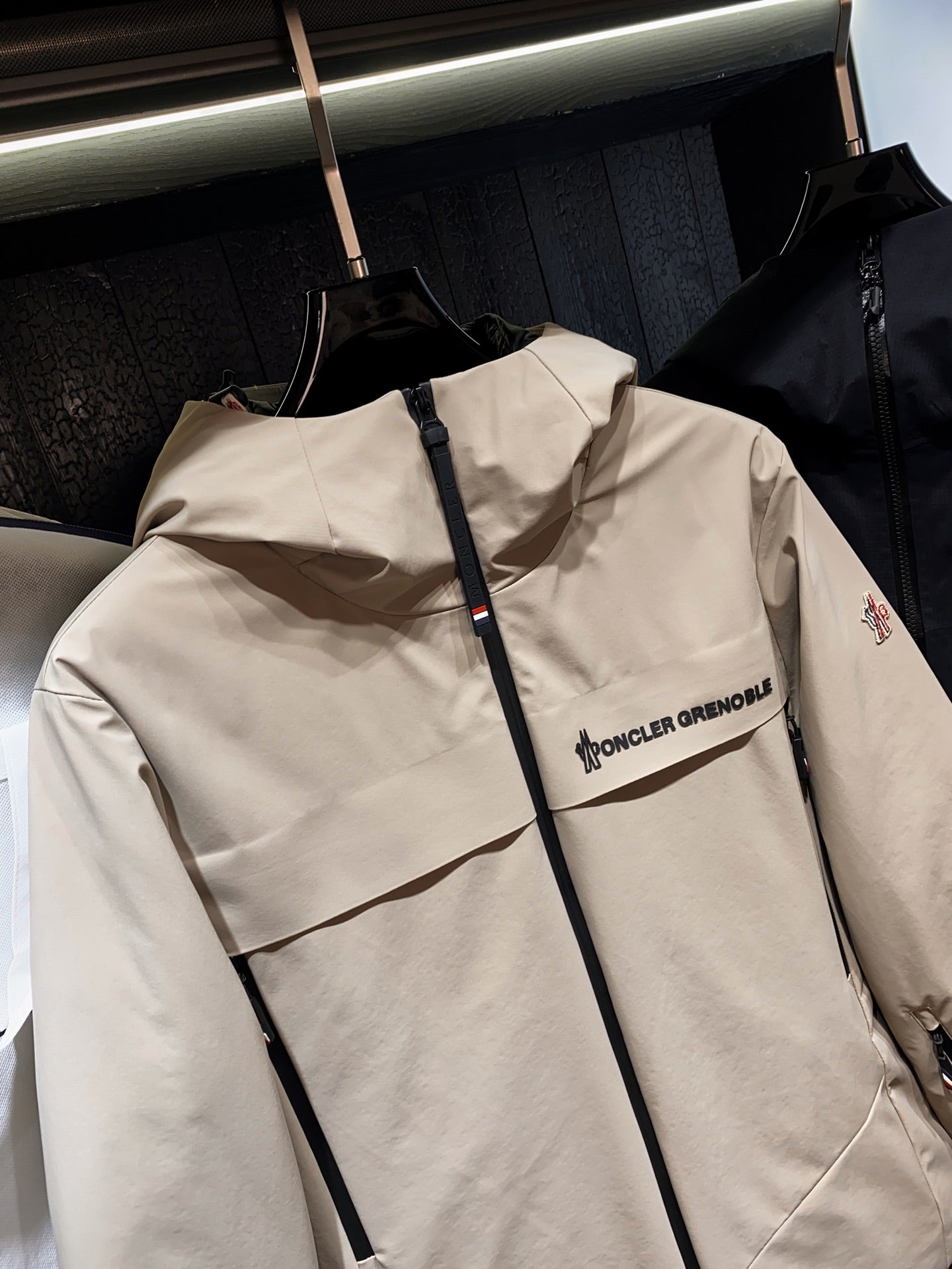 Beige hooded jacket with zip front and chest logo detail