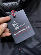 Moncler hang tag on dark jacket with high performance text