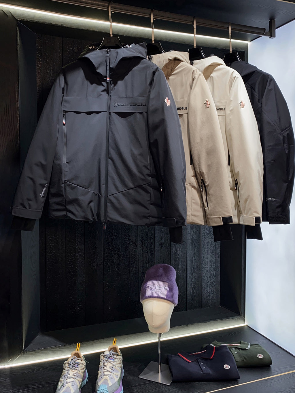 Navy long parka jacket with full-length zipper and attached hood