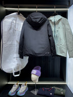 Black long parka jacket with hood and front zipper