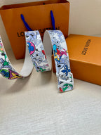 Louis Vuitton belt showing white cartoon-pattern strap and silver buckle detail