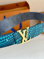 Turquoise dotted belt with gold-tone buckle and dark inner strap edge