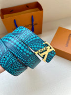 Turquoise dotted belt with gold LV buckle on a folded strap