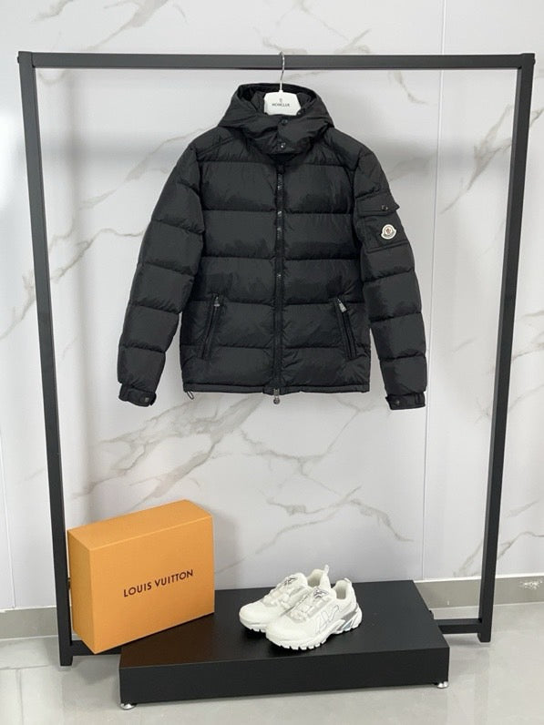 Black long puffer jacket with hood and zip front, two front pockets