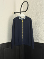 Navy Burberry zip-up hoodie with stand collar and gold zipper