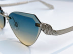 Bvlgari cat-eye sunglasses close-up with blue gradient lenses and rhinestone arm