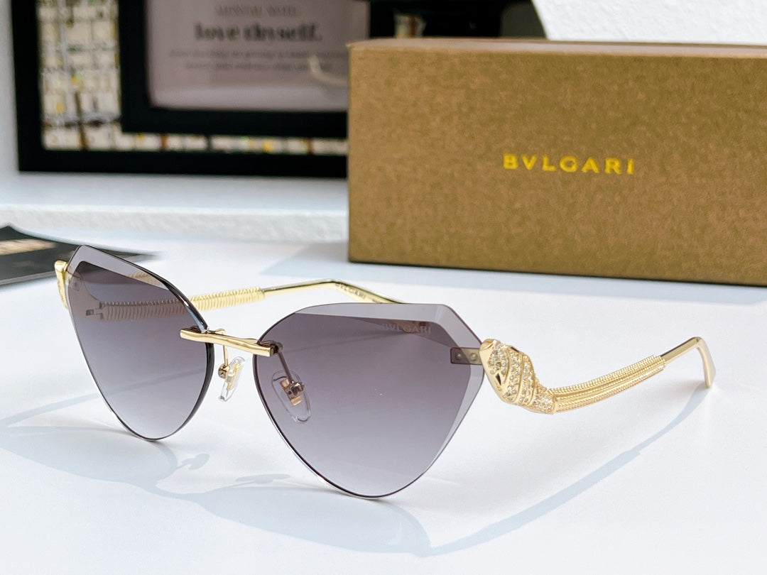 Bvlgari cat-eye sunglasses with gold frame and dark gray gradient lenses