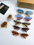 Assorted Bvlgari sunglasses with multicolor lenses arranged on white surface