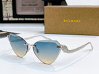 Bvlgari cat-eye sunglasses with silver frame and light blue-to-gold gradient lenses