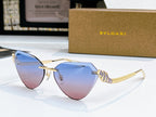 Bvlgari cat-eye sunglasses with gold frame and blue-to-pink gradient lenses