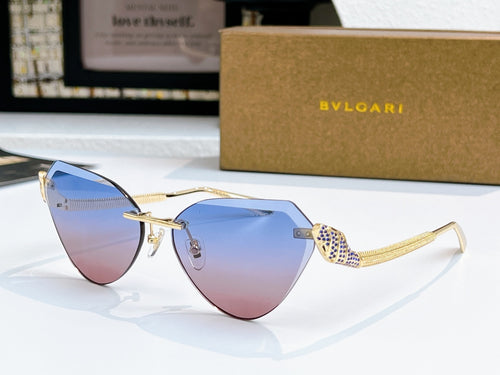 Bvlgari cat-eye sunglasses with gold frame and blue-to-pink gradient lenses