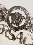 White Versace logo T-shirt close-up of lion crest and metallic print