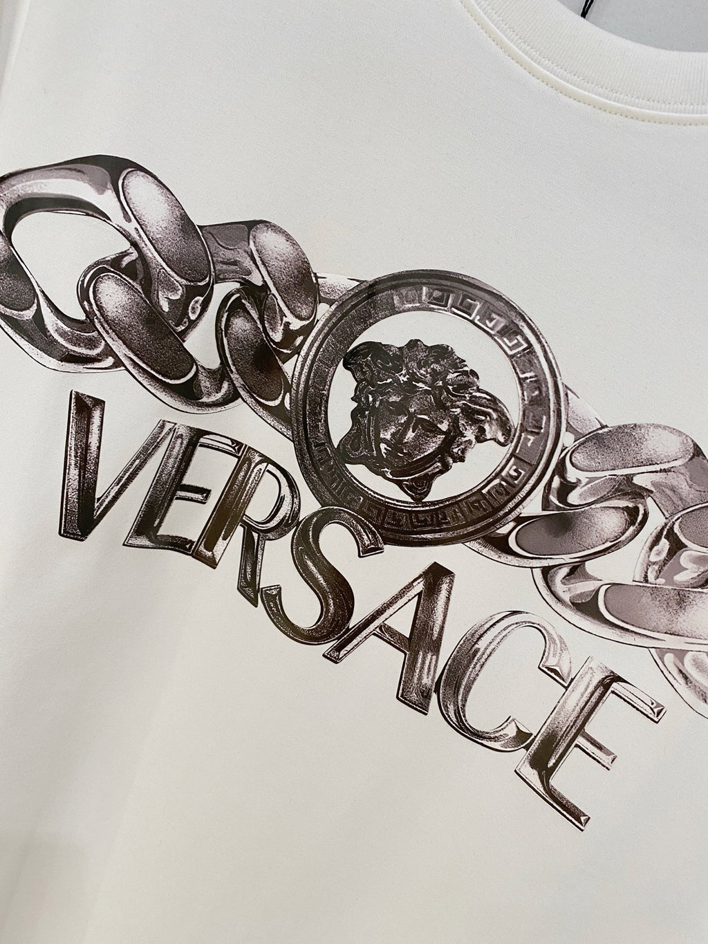 White Versace logo T-shirt with large silver lion crest graphic