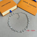 Louis Vuitton silver-tone charm bracelet with clover, star and link chain details