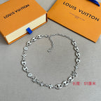 Louis Vuitton silver-tone charm bracelet with clover, star and link chain details