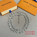 Louis Vuitton silver-tone charm bracelet with clover, star, heart-style links and chain