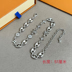 Louis Vuitton silver-tone charm bracelets with clover and star charms, chain extender